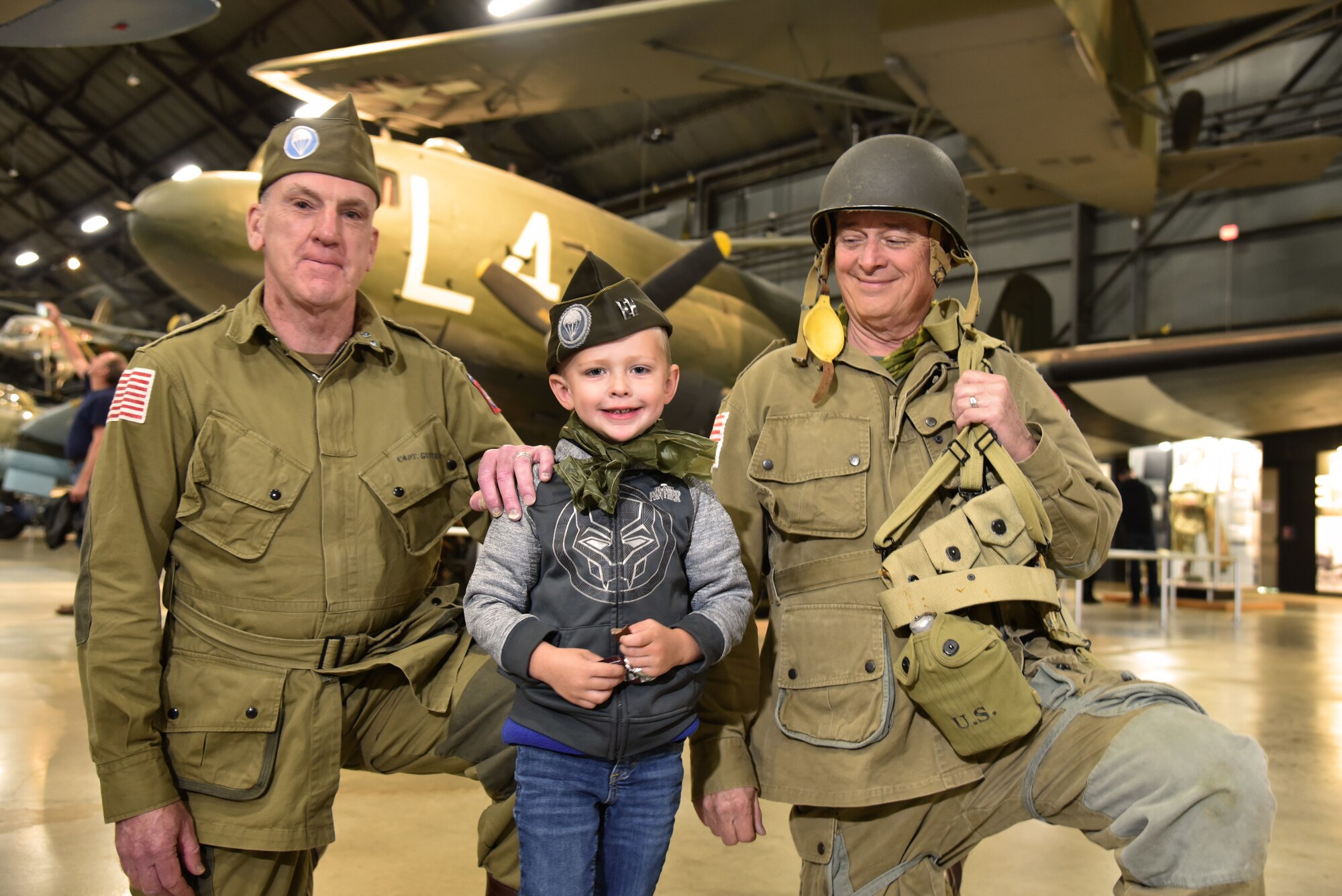 WWII Paratrooper reenactors pose with museum visitors at the National Museum of the USAF on May, 13, 2019.