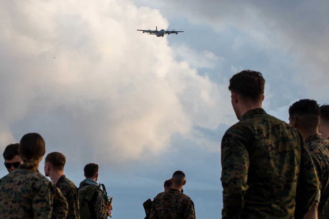 U.S. Marine Corps parachute riggers conduct air delivery operations using a KC-130 Hercules April 29, 2019 at Ie Shima, Okinawa, Japan. 3rd Air Delivery Platoon, Landing Support Company, Combat Logistics Regiment 3, 3rd Marine Logistics Group, conduct regular training to certify their Marines in various airborne resupply missions. (U.S. Marine Corps photo by Lance Cpl. Isaiah Campbell)
