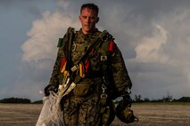 U.S. Marine Corps Gunnery Sgt. Paul Konicki completes a freefall jump during air delivery operations April 29, 2019 at Ie Shima, Okinawa, Japan. 3rd Air Delivery Platoon, Landing Support Company, Combat Logistics Regiment 3, 3rd Marine Logistics Group, conducts regular training to certify their Marines in various airborne resupply missions. Konicki  is a native of Dayton, Ohio. (U.S. Marine Corps photo by Lance Cpl. Isaiah Campbell)