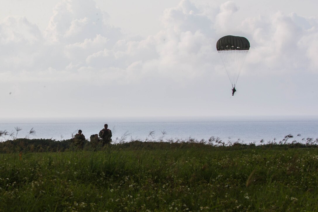 U.S. Marine Corps parachute riggers conduct air delivery operations April 29, 2019 at Ie Shima, Okinawa, Japan. 3rd Air Delivery Platoon, Landing Support Company, Combat Logistics Regiment 3, 3rd Marine Logistics Group, conduct regular training to certify their Marines in various airborne resupply missions. (U.S. Marine Corps photo by Lance Cpl. Isaiah Campbell)