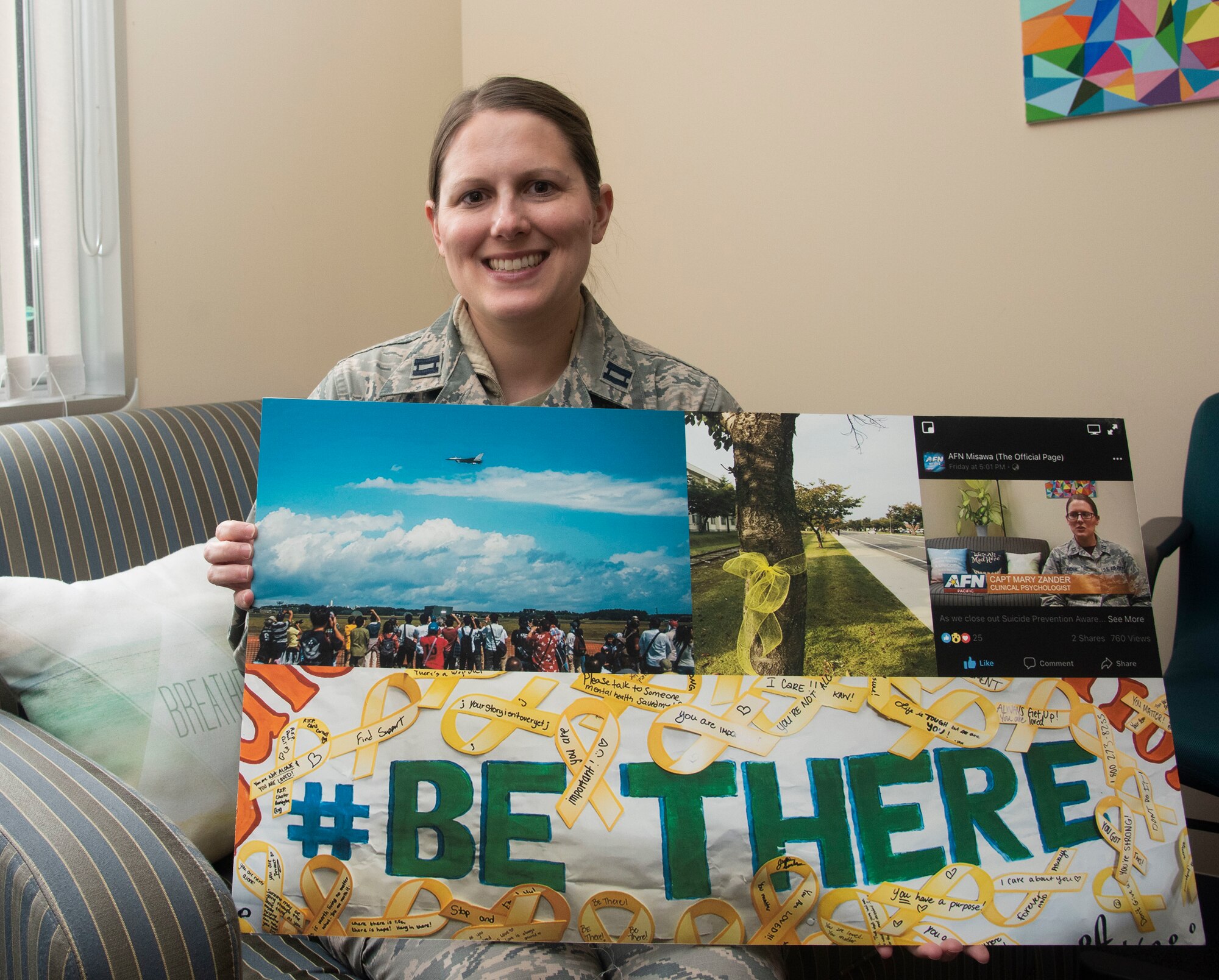 U.S. Air Force Capt. Mary Zander, a 35th Medical Operations Squadron clinical psychologist and the suicide prevention program manager, holds up a suicide awareness poster board at Misawa Air Base, Japan, May 9, 2019. Zander reached out to various units in coordinating suicide awareness events throughout 2018 to help community members talk more about suicide prevention. (U.S. Air Force photo by Senior Airman Sadie Colbert)