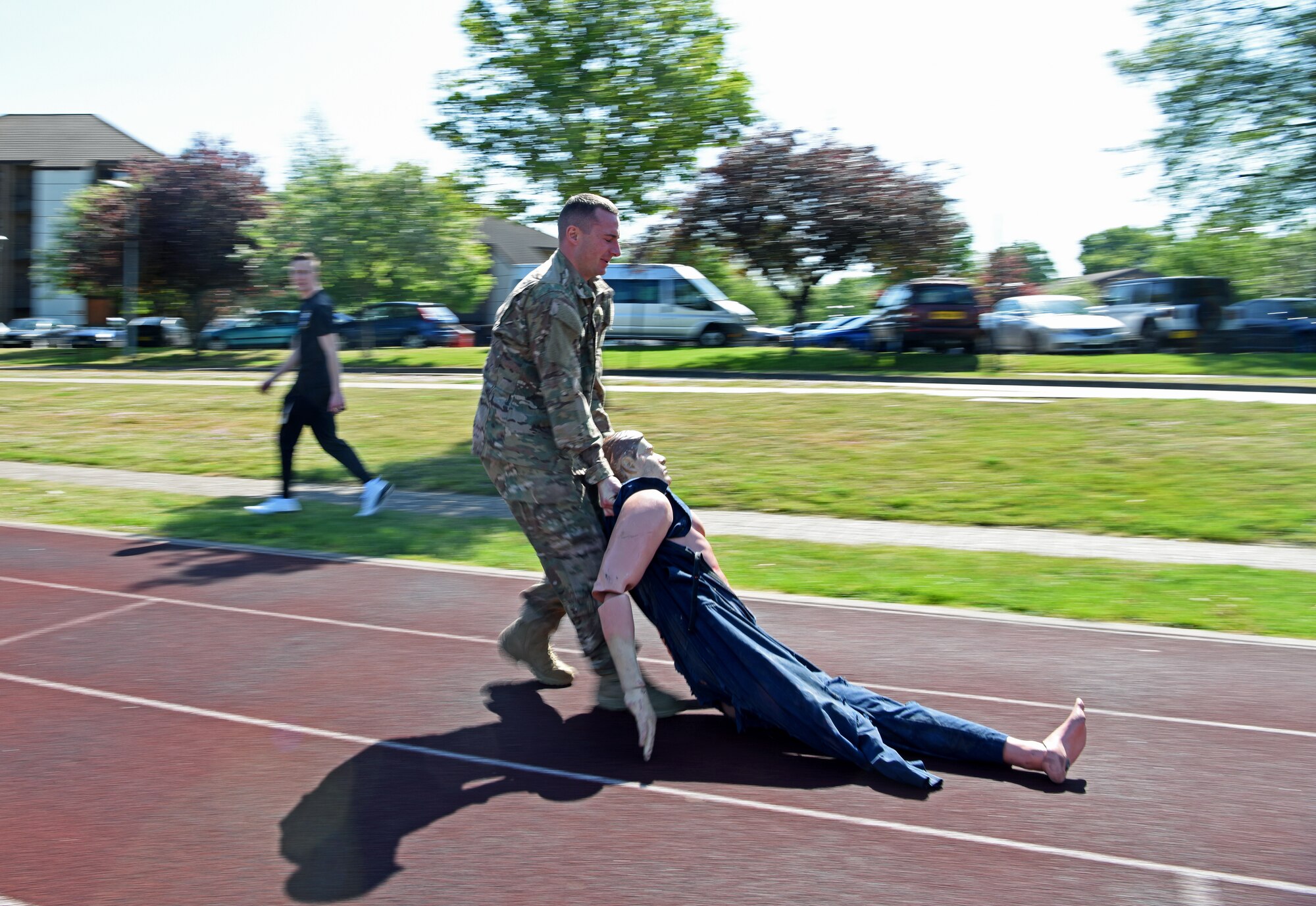 U.S. Air Force 1st Lt. Ricky Sizemore, 100th Security Forces Squadron flight commander, drags a casualty dummy during the 48th Security Forces Squadron’s “Spartan Race,” which is a part of National Police Week at RAF Lakenheath, England, May 14, 2019. National Police Week is a chance for all law enforcement officials to pay respects to the officers who came before them, and also gives the base community the opportunity to support the force as well. (U.S. Air Force photo by Airman 1st Class Brandon Esau)