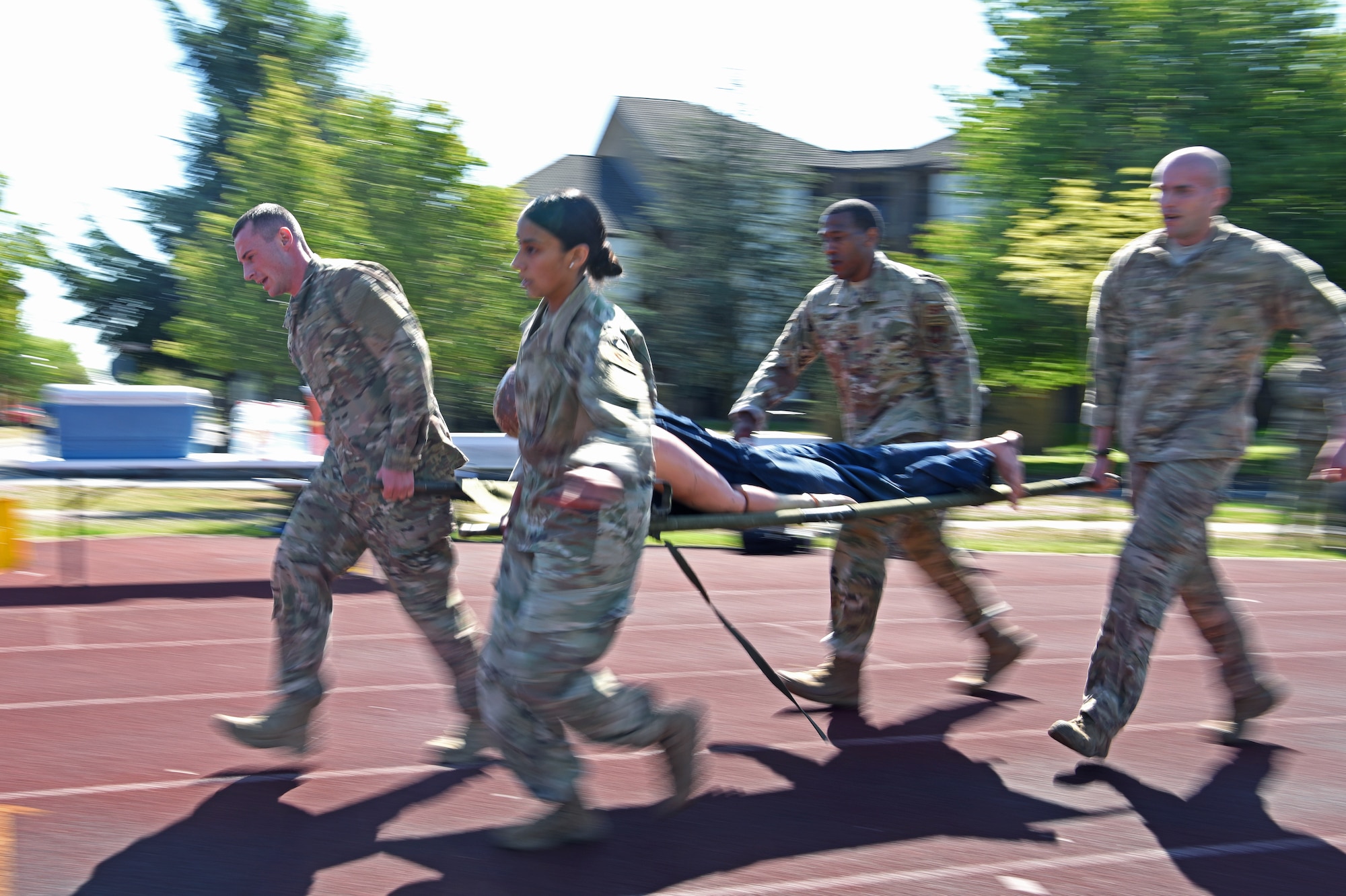 Defenders from the 100th Security Forces Squadron at RAF Mildenhall, perform a casualty evacuation during the 48th Security Forces Squadron’s “Spartan Race” at RAF Lakenheath, England, May 14, 2019. The “Spartan Race” is part of the week-long National Police Week recognition, in which both squadrons held events May 13-17. (U.S. Air Force photo by Airman 1st Class Brandon Esau)