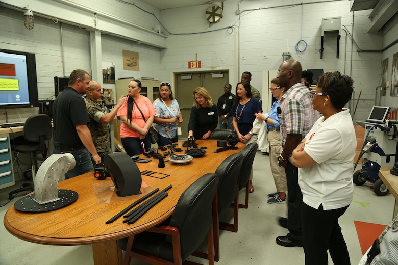 Several spouses participate in Marine Corps Logistics Command's first Mission Overview Course for Spouses at the Town and Country Ballroom aboard Marine Corps Logistics Base Albany, May 1. 

The course consisted of a command brief, team building activity and tours of Marine Depot Maintenance Command and Marine Force Storage Command.