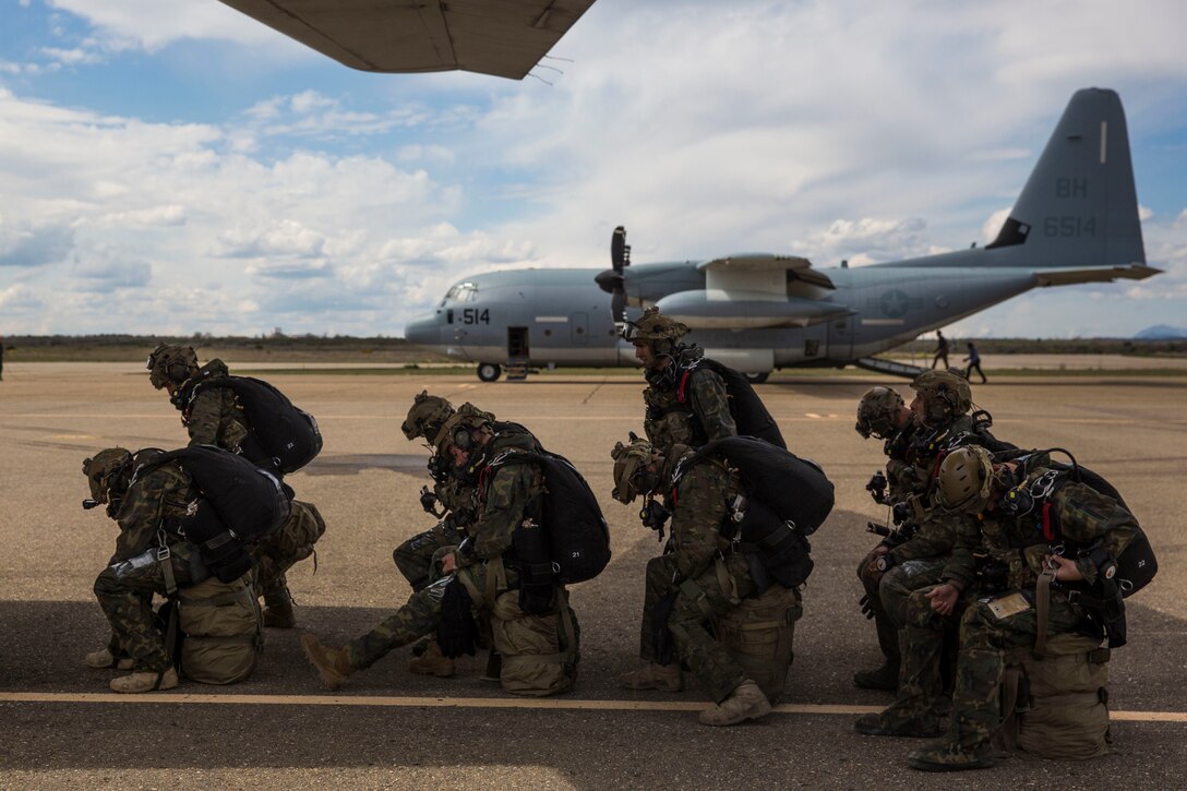 Spanish service members prepare to board a Spanish T21 aircraft for a high-altitude low-opening jump during exercise Lone Paratrooper at Leon Air Base, Spain, May 6, 2019. Special Purpose Marine Air-Ground Task Force-Crisis Response-Africa 19.2, Marine Forces Europe and Africa, supported the exercise with aerial-delivery Marines and a KC-130J Super Hercules. Lone Paratrooper is a multinational exercise hosted to improve training tactics, exchange knowledge, and increase relationships among allied and partner nations. SPMAGTF-CR-AF is deployed to conduct crisis-response and theater-security operations in Africa and promote regional stability by conducting military-to-military training exercises throughout Europe and Africa. (U.S. Marine Corps photo by Cpl. Margaret Gale)