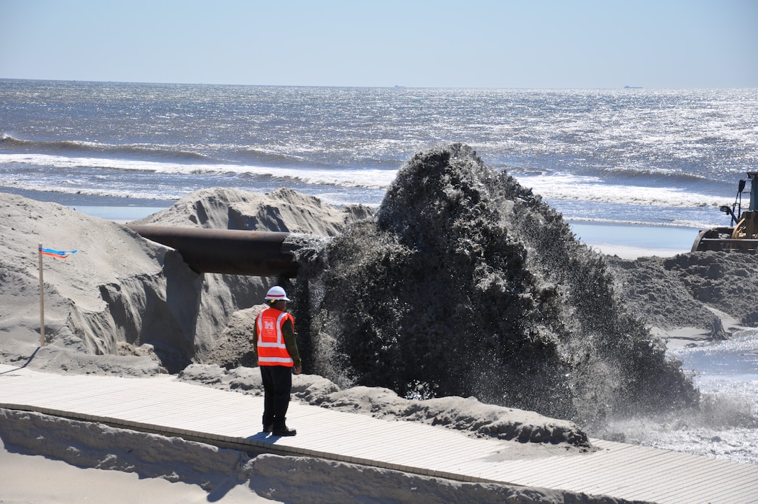 USACE personnel inspects sand discharge at East Rockaway Inlet Dredging Project.
