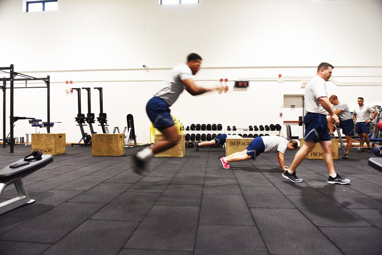 Airmen assigned to the 39th Air Base Wing conduct a physical training session at the newly renovated Larger than Life fitness center weight room on May 15, 2019, at Incirlik Air Base, Turkey. Shortly after the ceremony, Tech. Sgt. Elizabeth Corpus, 39th ABW command section NCO in charge, led a workout focusing on muscle endurance and exercises to help Airmen prepare for job-specific fitness tests. (U.S. Air Force photo by Senior Airman Joshua Magbanua)