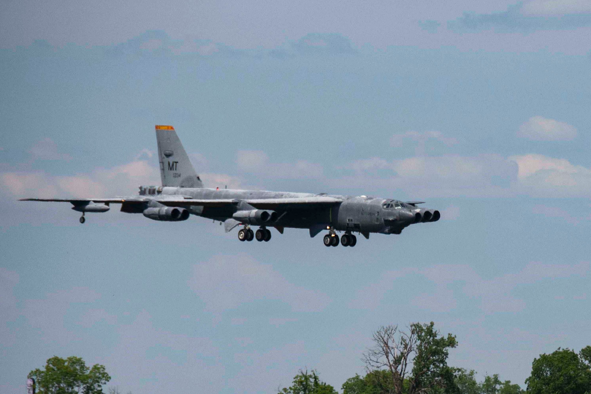 A B-52 Stratofortress, nicknamed "Wise Guy," makes its final approach to Barksdale Air Force Base, Louisiana, May 14, 2019.  The bomber was flown out of the 309th Aerospace Maintenance and Regeneration Group, also known as the "Boneyard", where it had been since 2008.  (U.S. Air Force photo by Master Sgt. Ted Daigle)