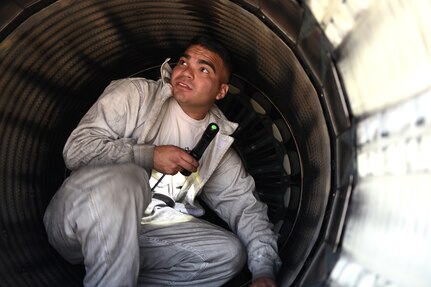 Staff Sgt. Christopher Ortega, a crew chief assigned to the 149th Fighter Wing, Air National Guard, inspects the intake an F-16 Fighting Falcon for debris or damage during Coronet Bronco April 29 at Mountain Home Air Force Base, Idaho. The annual training event deploys members of the 149th Fighter Wing, headquartered at Joint Base San Antonio-Lackland, to another environment in order to familiarize them with accomplishing mission objectives in an unfamiliar location.