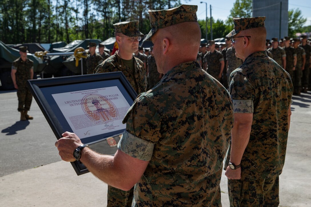 U.S. Marine Sgt. Maj. Richard D. Tresher, the sergeant major of II Marine Expeditionary Force, reads the citation of the Lt. Gen. Chesty Puller Outstanding Leadership Award, on Camp Lejeune, N.C., May 1, 2019. 2nd Light Armored Reconnaissance Battalion was awarded for their professional achievement and sustained superior performance in training, maintaining, fostering, nurturing, and mentoring Marines and Sailors, as well as exceeding unit mission requirements from 1 January 2018 to 31 December 2018. (U.S. Marine Corps photo by Lance Cpl. Nathaniel Q. Hamilton)
