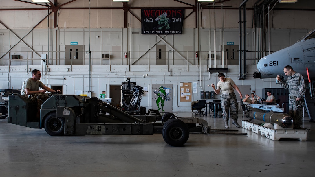 From left, Master Sgt. Chris Hattery, Senior Airman Ashley Kjos and Staff Sgt. Nick Jaqua, 363rd Training Squadron armament apprentice course students, load an AGM-65 Maverick training missile onto an A-10 Thunderbolt II at Sheppard Air Force Base, Texas, May 14, 2019. The AGM-65 uses an infrared guidance system that tracks heat generated from the targets. The AGM-65 weighs about 500 lbs. (U.S. Air Force photo by Airman 1st Class Pedro Tenorio)