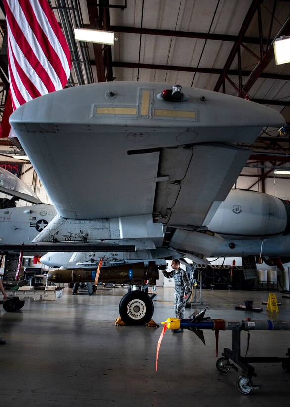 Staff Sgt. Nick Jaqua, 363rd Training Squadron armaments apprentice course students, loads an AGM-65 Maverick training missile at Sheppard Air Force Base, Texas, May 14, 2019. The AGM-65 weighs about 500 lbs.. Jaqua is on Block 8 of his training and is slated to graduate May 22, 2019. (U.S. Air Force photo by Airman 1st Class Pedro Tenorio)