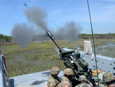Virginia National Guard Soldiers assigned to the Norfolk-based 1st Battalion, 111th Field Artillery Regiment, 116th Infantry Brigade Combat Team conduct waterborne artillery live fire exercises during Operation GATOR April 24-25, 2019, at Camp Lejeune, North Carolina.