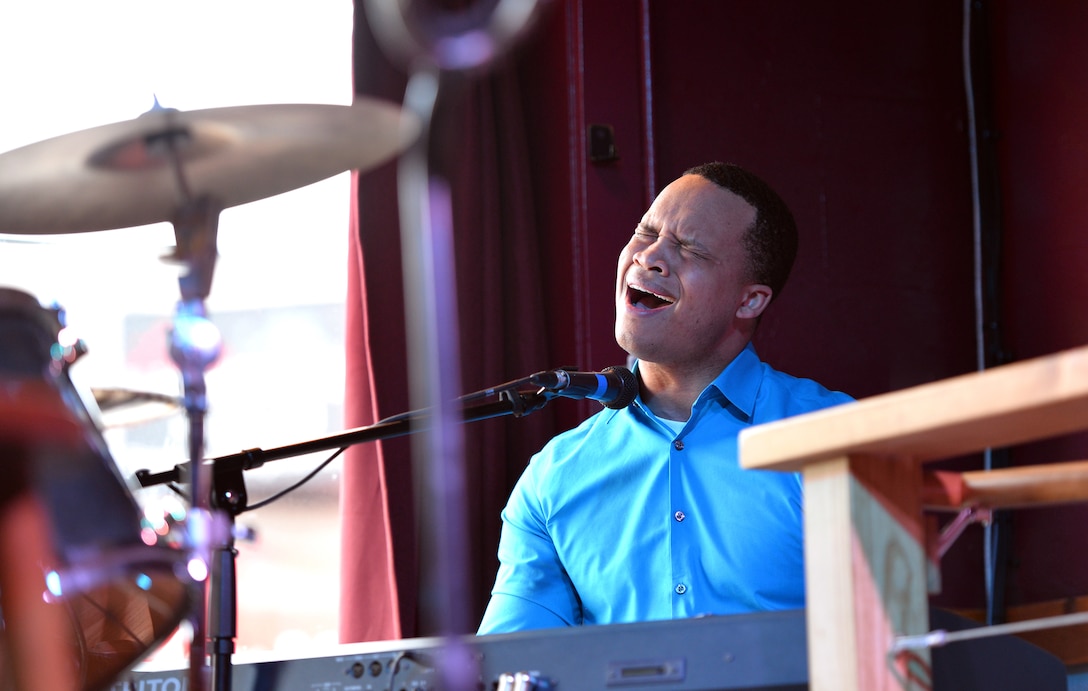 Airman 1st Class Mario Foreman-Powell, a vocalist with the United States Air Force Heartland of America Band, competes in the Omaha Performing Arts Singer-Songwriter Competition at B Side Theatre, Nebraska, May 6, 2019. Airman Foreman-Powell competed against nine other musician for the chance to take the stage and perform at the MAHA Music Festival held in Omaha, Nebraska. (U.S. Air Force photo by Josh Plueger)