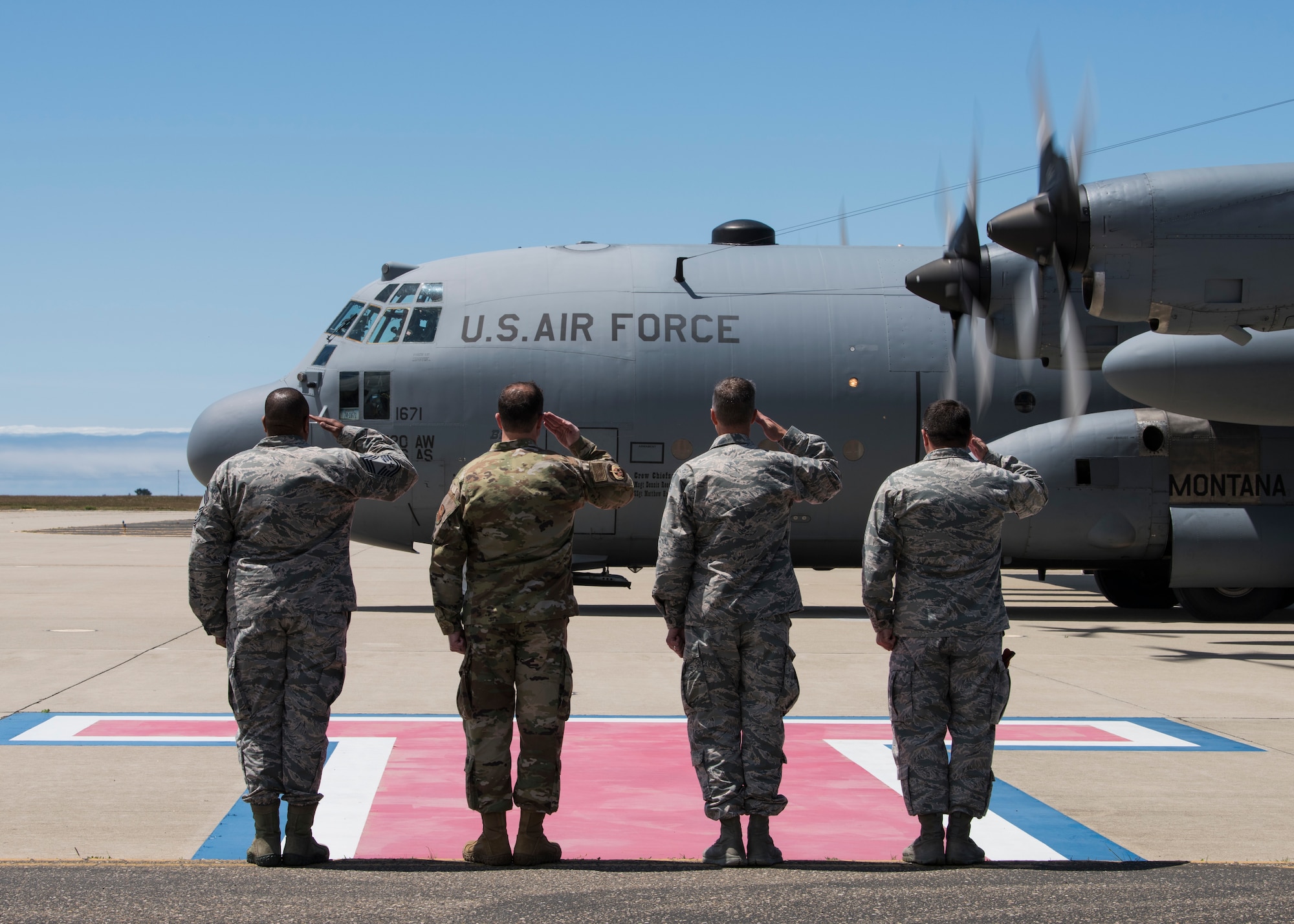 From right to left, Brig. Gen. Wolfe Davidson, 14th Air Force vice commander, Col. Michael Hunsberger, 30th Mission Support Group commander, Col. David Kelley, 576th Flight Test Squadron commander and Chief Master Sgt. Raymond Riley, acting 30th Space Wing command chief, salute a C-130 Hercules transporting the Chief of Staff of the Air Force civic leaders May 7, 2019, at Vandenberg Air Force Base, Calif. The CSAF civic leaders met with key agencies during their two day visit at Vandenberg AFB to gain an in-depth understanding of Air Force Minuteman III test launch capabilities. (U.S. Air Force photo by Airman 1st Class Aubree Milks)