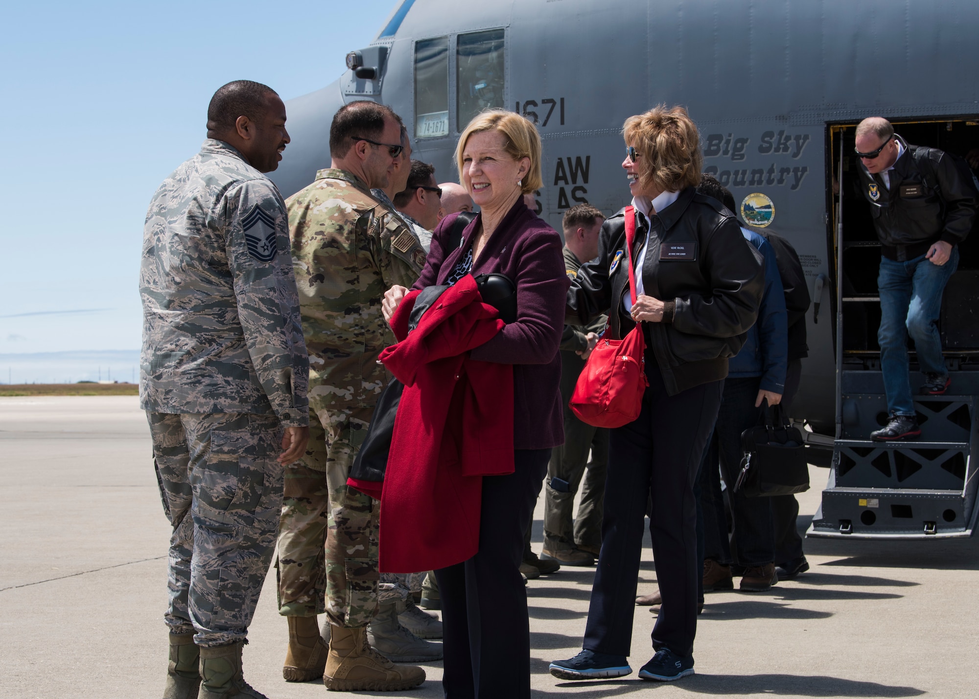 Members of base leadership greet Pam Younker and Vickie McCall, Chief of Staff of the Air Force civic leaders, upon their arrival May 7, 2019, at Vandenberg Air Force Base, Calif. The CSAF civic leaders were transported from Malmstrom AFB to Vandenberg AFB as part of a four-day immersion tour to gain an in-depth understanding of space partnerships and Minuteman III modernization. (U.S. Air Force photo by Airman 1st Class Aubree Milks)
