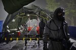 Soldiers from 181st Chemical Company (Hazard Response), Task Force Ops, Joint Task Force Civil Support (JTFCS), are prepared for role-players to come through their Mass Casualty Decontamination line at Exercise Guardian Response at Muscatatuck Urban Training Center, May 4, 2019. When directed, JTFCS provides command and control of the 5,200-person Defense Chemical Biological Radiological Nuclear (CBRN) Response Force (DCRF) during a catastrophic crisis in support of civil authorities and the lead federal agency. Vibrant Response/Guardian Response is an annual, combined Command Post Exercise and Field Training Exercise which validates the ability of the DCRF forces to conduct the CBRN Response mission. (U.S. Army photo by 2nd Lt. Corey Maisch/released)