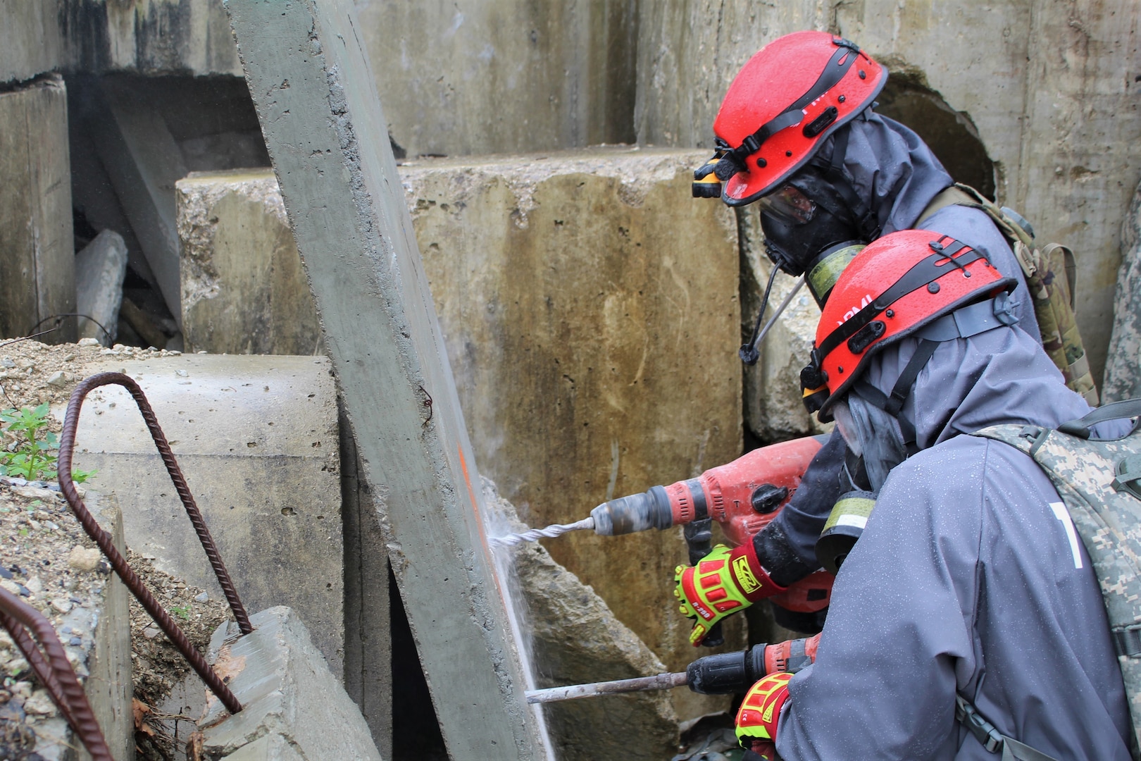 Soldiers from 68th Engineer Construction Company, Task Force Operations, Joint Task Force Civil Support (JTFCS), conduct a clean breach through a slab of concrete to train their urban search and rescue skills at Exercise Guardian Response at Muscatatuck Urban Training Center, May 4, 2019. When directed, JTFCS provides command and control of the 5,200-person Defense Chemical Biological Radiological Nuclear (CBRN) Response Force (DCRF) during a catastrophic crisis in support of civil authorities and the lead federal agency. Vibrant Response/Guardian Response is an annual, combined Command Post Exercise and Field Training Exercise which validates the ability of the DCRF forces to conduct the CBRN Response mission. (U.S. Army photo by 2nd Lt. Corey Maisch/released)