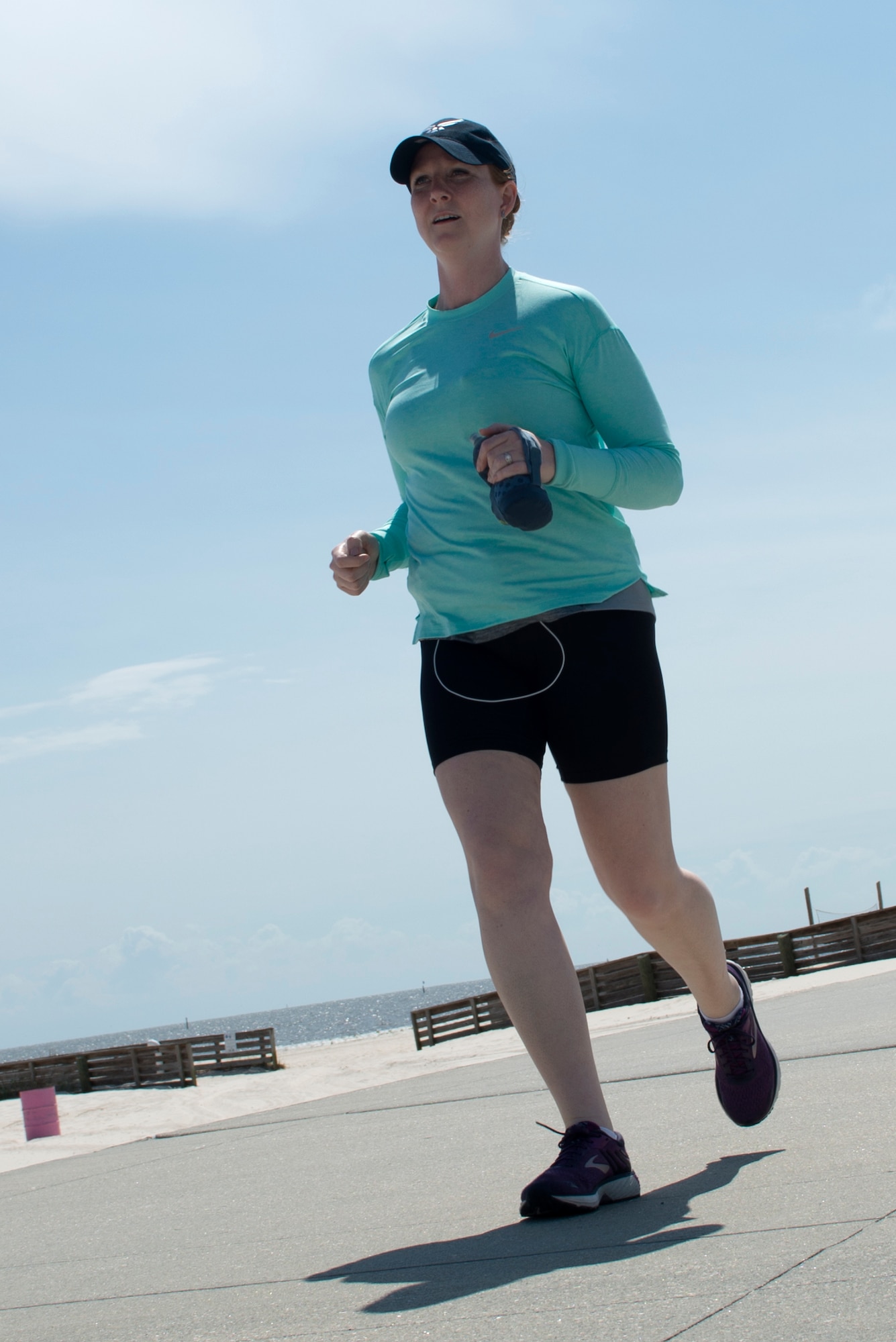 U.S. Air Force Capt. Kelly Hiser, 335th Training Squadron force support officer, runs during the Crawfish Relay at Biloxi, Mississippi, May 3, 2019. The relay team, "Unicorn of the Sea," accepted the challenge of the Crawfish Relay to not only push themselves, but to honor two special tactics Airmen killed in action, U.S. Air Force Master Sgt. John Chapman and U.S. Air Force Staff Sgt. Dylan Elchin. (U.S. Air Force photo by Airman Seth Haddix)