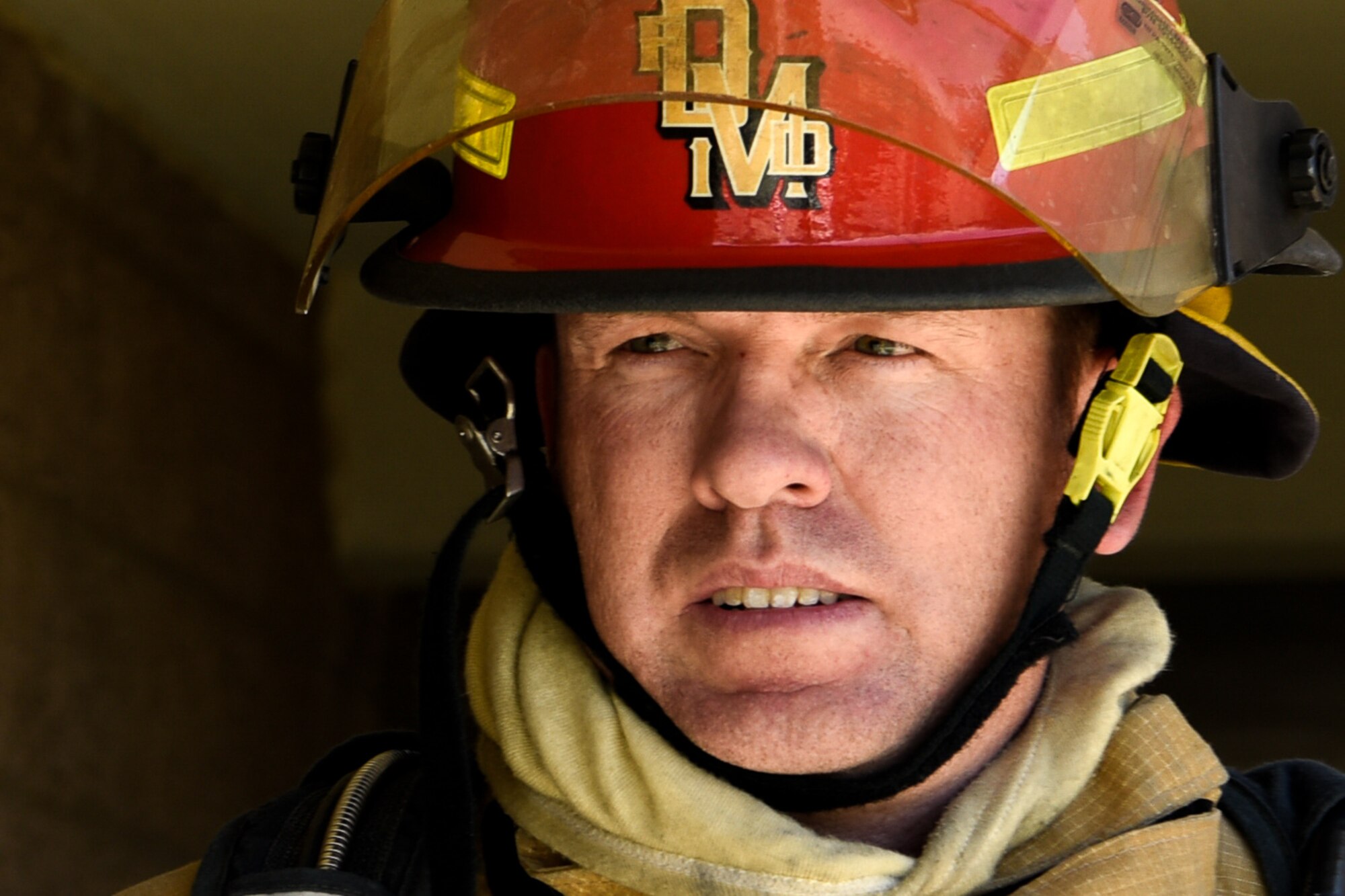 A firefighter watches team members during a joint training exercise May 3, 2019, at Luke Air Force Base, Ariz. Multi-company standard trainings such as these help firefighters to practice basic operating procedures together so they can be effectively used in real world situations. (U.S. Air Force photo by Airman 1st Class Zoie Cox)
