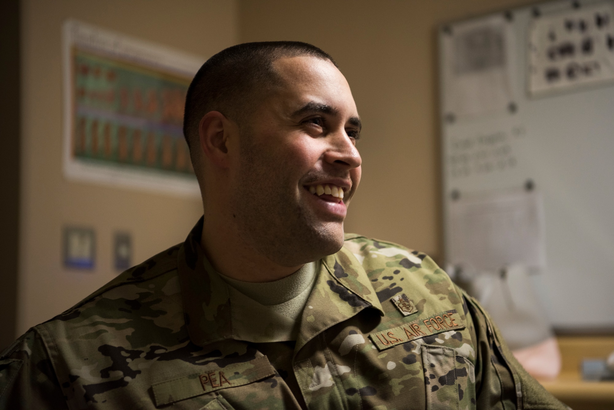 U.S. Air Force Staff Sgt. Nance Pea, the 35th Surgical Operations Squadron ultrasound NCO in charge, smiles while interacting with a patient at Misawa Air Base, Japan, April 10, 2019. Radiology technologists use diagnostic imaging, x-ray examinations, magnetic resonance imaging scans and computed tomography scans to care for patients and provide doctors with vital images that detect potential medical concerns. (U.S. Air Force photo by Senior Airman Collette Brooks)