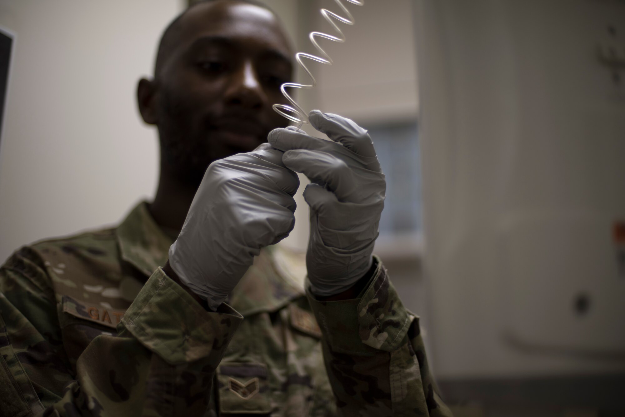 U.S. Air Force Senior Airman William Gathers III, a 35th Surgical Operations Squadron radiology technologist, prepares for a contrast enhance computed tomography examination at Misawa Air Base, Japan, April 10, 2019. Radiology technologists use special dye to find pathologies and the location of diseases within the body. The process enhances the contrast between lesions and the normal surrounding structures improving the clarity and visibility of abnormalities. (U.S. Air Force photo by Senior Airman Collette Brooks)