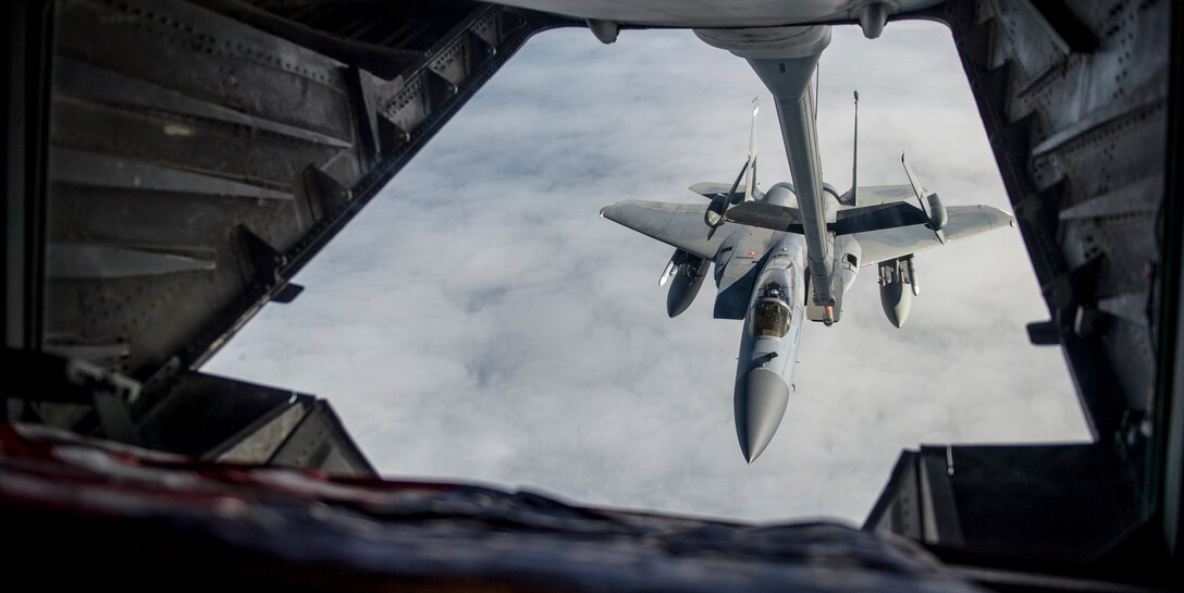 Airmen from the 6th and 9th Air Refueling Squadrons out of Travis Air Force Base, Calif., use a U.S. Air Force KC-10 Extender to refuel a U.S Air Force F-15C Eagle, as part of exercise Northern Edge, May 14, 2019, at Joint Base Elmendorf-Richardson, Alaska.