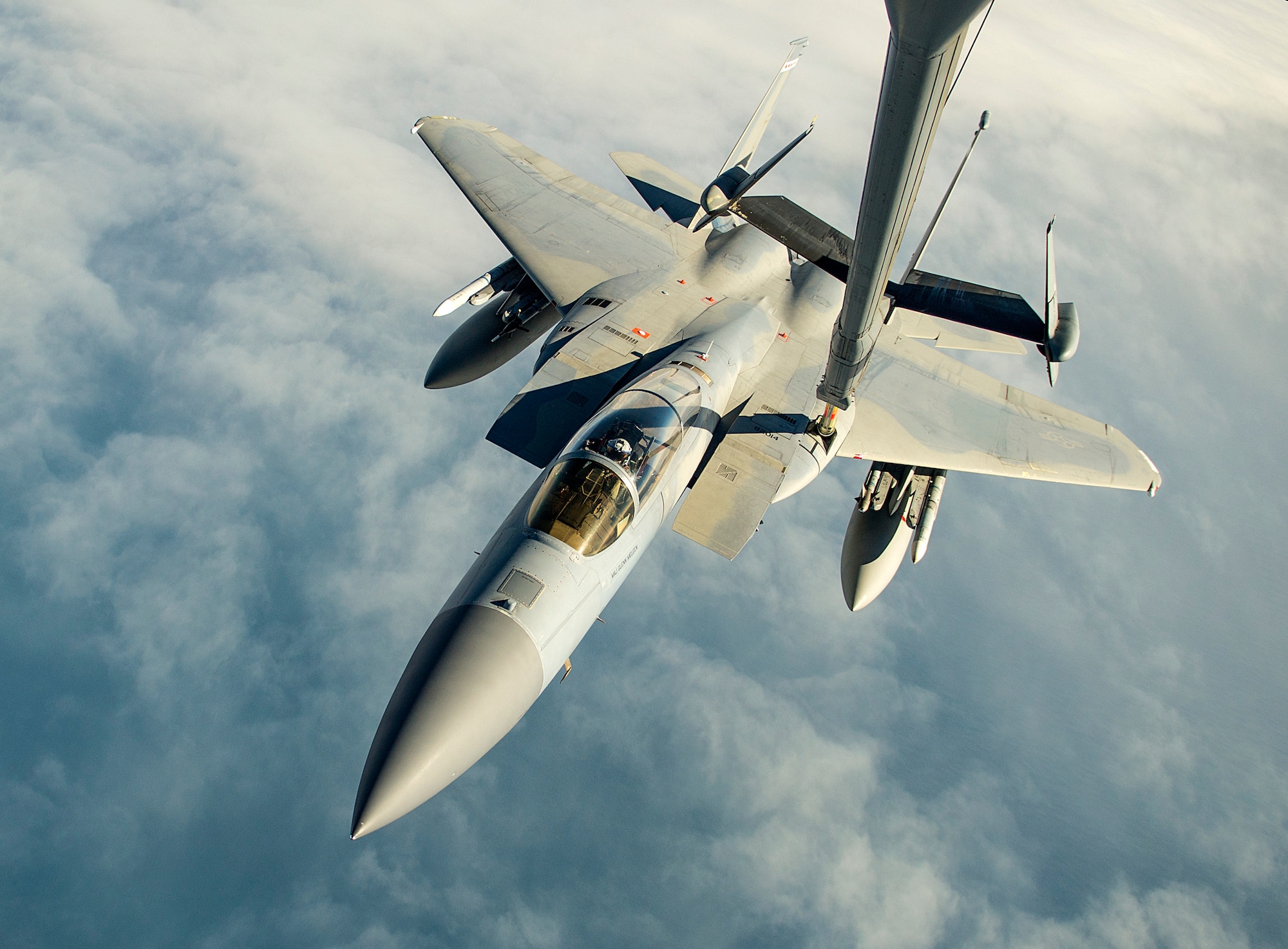 Airmen from the 6th and 9th Air Refueling Squadrons, Travis Air Force Base, Calif., use a U.S. Air Force KC-10 Extender to refuel a U.S Air Force F-15C Eagle, during exercise Northern Edge, May 14, 2019, at Joint Base Elmendorf-Richardson, Alaska.