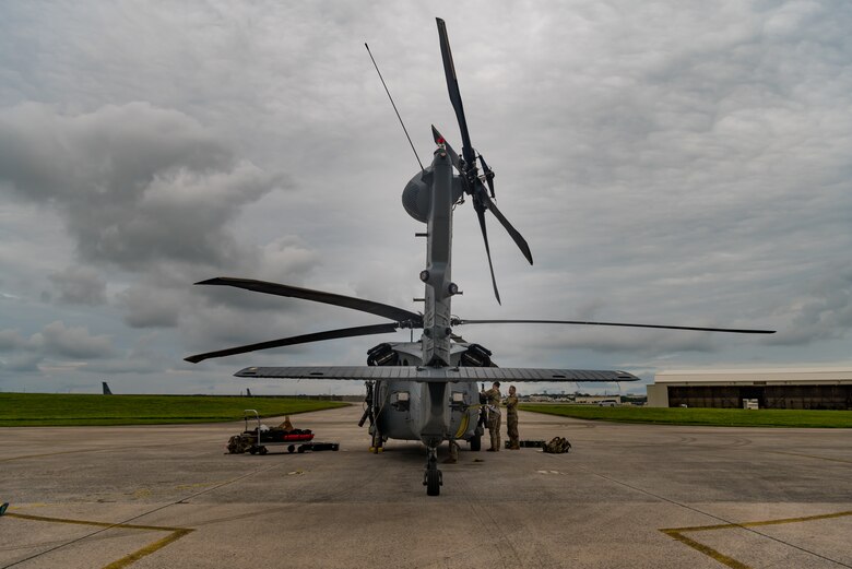 U.S. Air Force Tech. Sgt. Travis Kidwell, 33rd Rescue Squadron special mission aviator, prepares the gun aircraft unit on an HH-60G Pave Hawk during pre-flight inspections May 8, 2019, on Kadena Air Base, Japan.