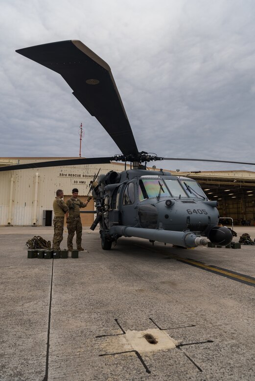 U.S. Air Force Tech. Sgt. Travis Kidwell, 33rd Rescue Squadron special mission aviator, performs pre-flight inspections on an HH-60G Pave Hawk May 8, 2019, on Kadena Air Base, Japan.