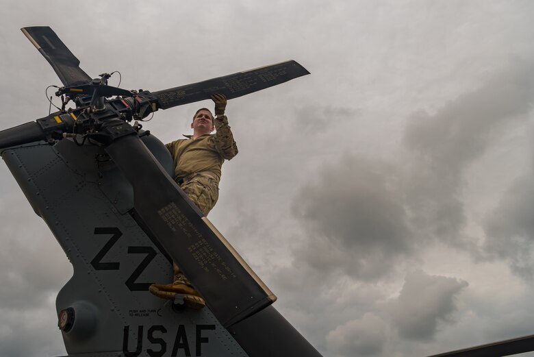 U.S. Air Force Tech. Sgt. Christopher Kersey, 33rd Rescue Squadron instructor special mission aviator, inspects the tail rotor paddles on an HH-60G Pave Hawk during pre-flight inspections May 8, 2019, on Kadena Air Base, Japan.