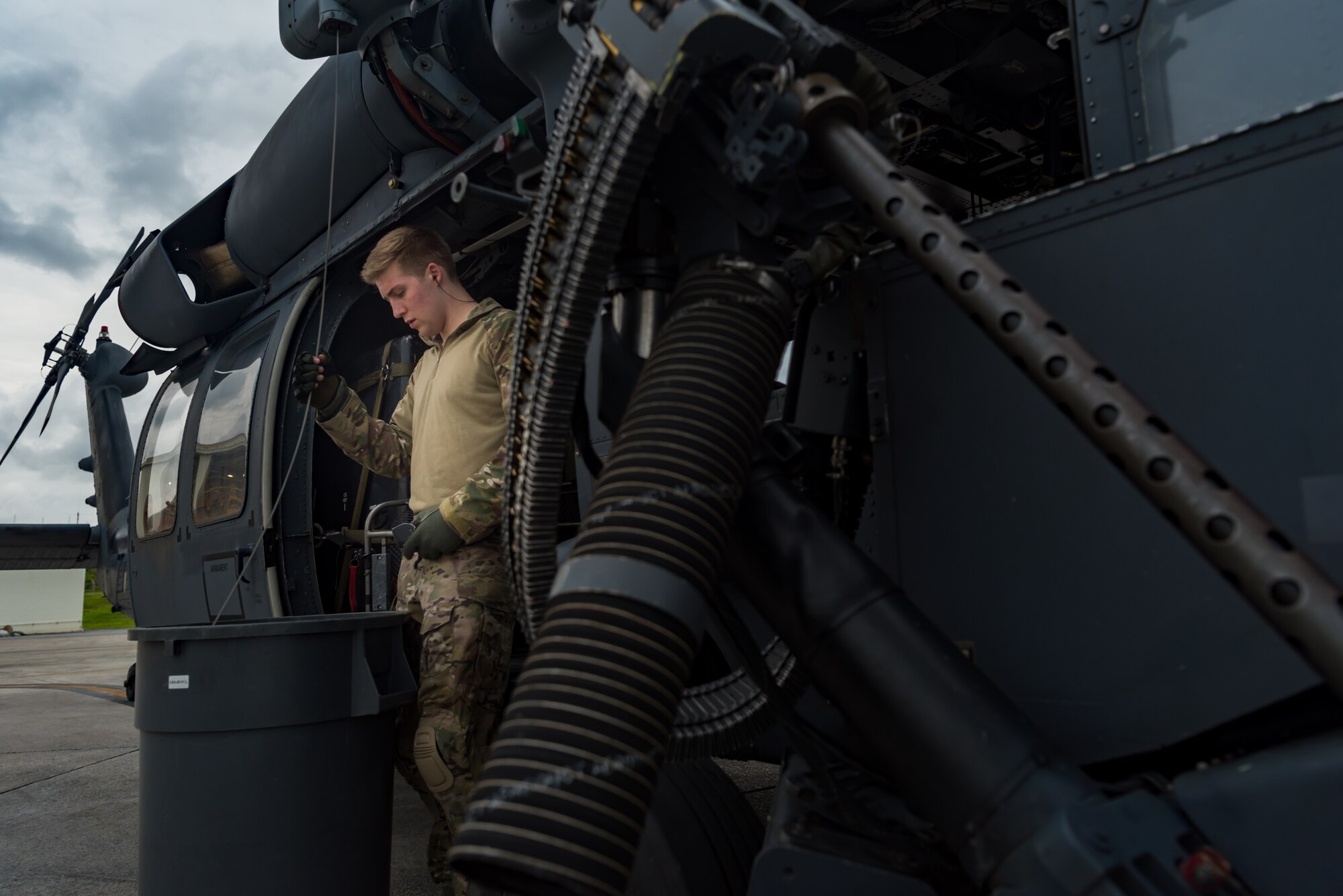 U.S. Air Force Senior Airman Chandler Hoskinson, 33rd Rescue Squadron special mission aviator, inspects the hoist cable on an HH-60G Pave Hawk May 8, 2019, on Kadena Air Base, Japan.