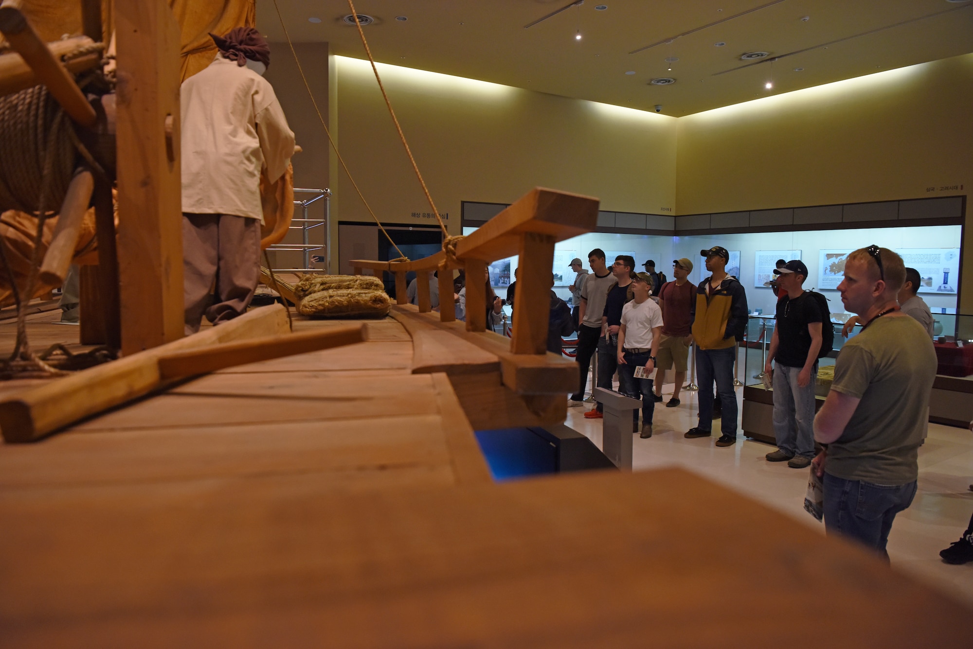 Airmen from the 8th Fighter Wing observe a wooden ship display and presentation in Gunsan Modern History Museum April 30, 2019. The Airmen visited the museum as part of an initiative to educate Airmen on Gunsan history and culture. (U.S. Air Force photo by Staff Sgt. Joshua Edwards)