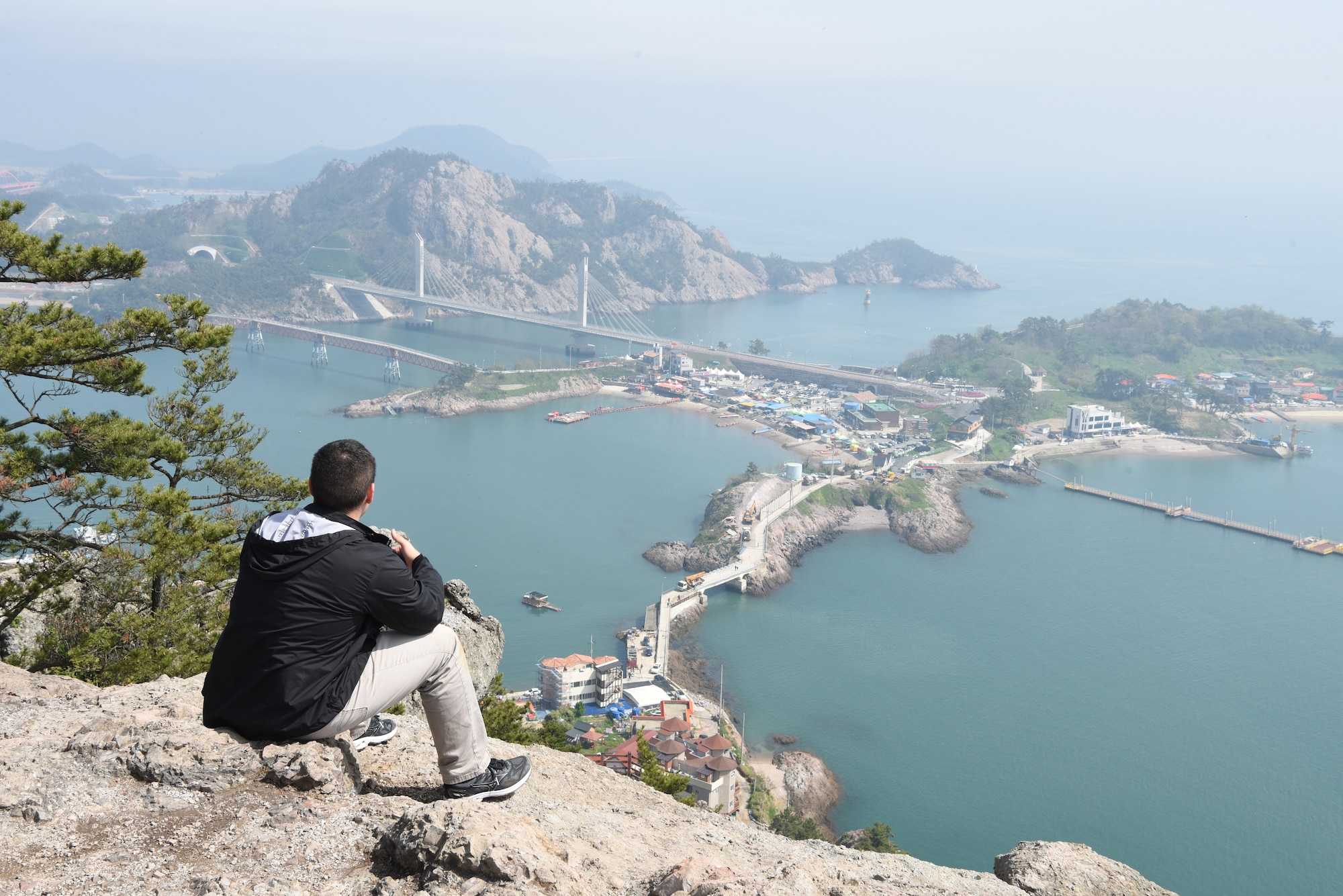 U.S. Air Force Senior Airman Stefan Alvarez, 8th Fighter Wing Public Affairs photojournalist, views Gogunsan Islands during a tour of Gunsan city April 30, 2019. The tour exposed Airmen to key landmarks in and near the city of Gunsan. The Gungunsan Islands is located 50 kilometers to the southwest of Gunsan and encompasses 63 islets.  (U.S. Air Force photo by Staff Sgt. Joshua Edwards)