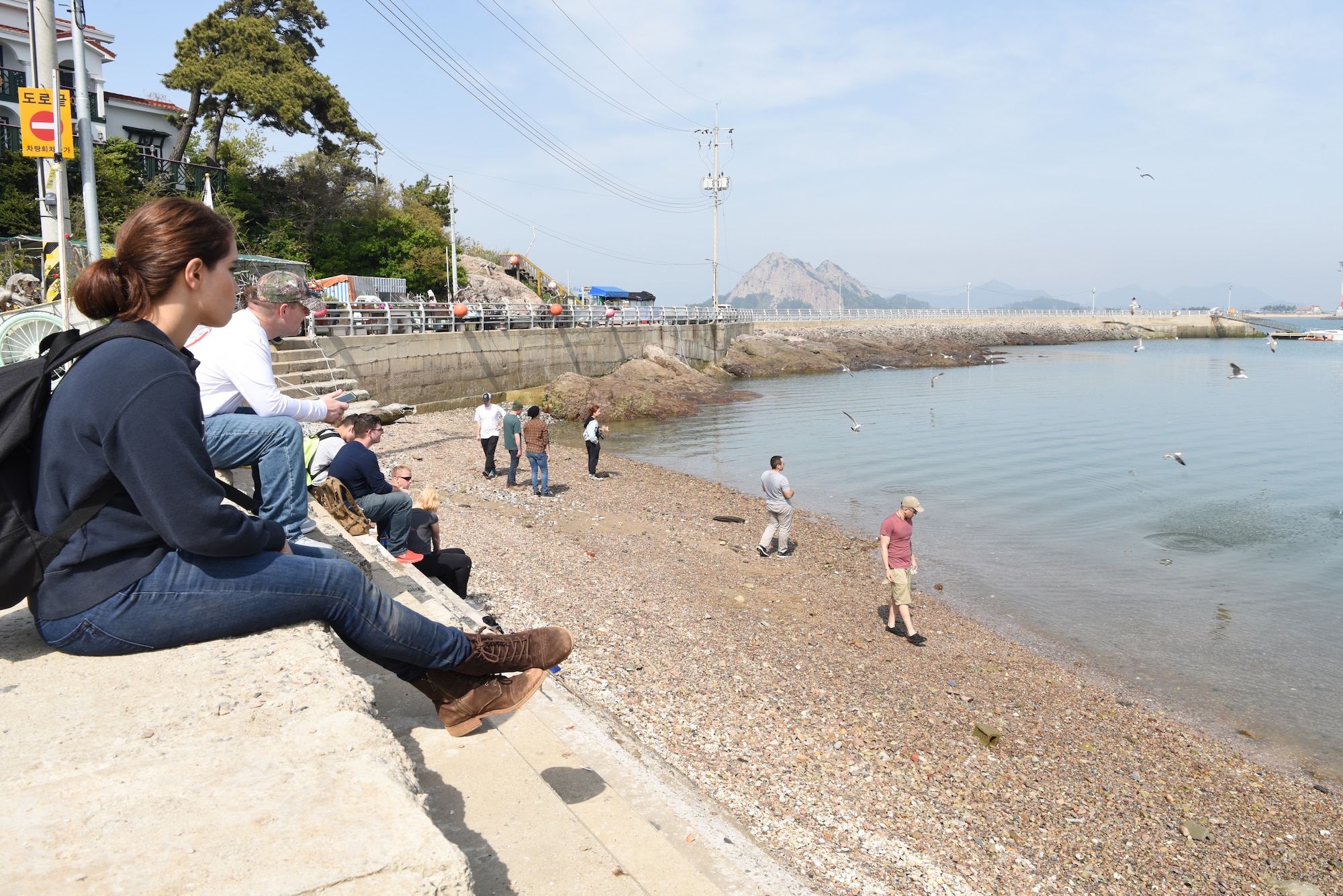 Airmen from Kunsan Air Base explore the beaches of the Gogunsan Islands during a Gunsan city tour April 30, 2019. The tour is an annual event that provides Airmen an opportunity to help give back and learn more about the city of Gunsan. (U.S. Air Force photo by Staff Sgt. Joshua Edwards)
