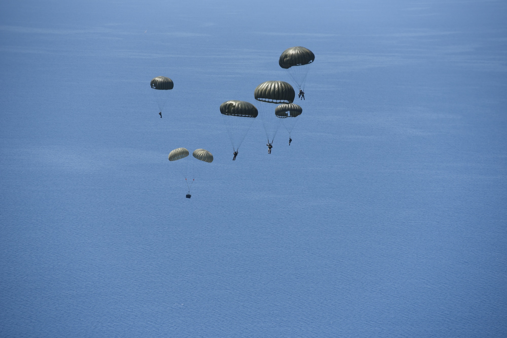 Hellenic military members parachute to a drop zone in the Aegean Sea during exercise Stolen Cerberus VI, May 9, 2019, off the coast of Greece. Stolen Cerberus is an annual bilateral training event with the Hellenic air force designed to enhance interoperability and airlift capabilities through realistic joint air operations training, including aeromedical evacuation operations and airlift and airdrop capabilities.