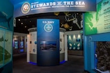 The Stewards of the Sea exhibit, which opened in 2013, highlights marine mammal research and shipboard environmental protection at Nauticus.