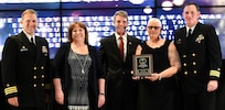 IMAGE: Fredericksburg, Va. (May 10, 2019) – Delois Clarke holds the Employee Development Award moments after receiving it from Naval Surface Warfare Center Dahlgren Division (NSWCDD) leadership at the command’s annual honor awards ceremony. Clarke was recognized for her exemplary execution as a leader across the organization. Her mentorship and persistence has led to a continuous pipeline of highly skilled personnel, enabling the successful maintenance of a key national capability. Standing left to right: NSWCDD Dam Neck Activity Commanding Officer Cmdr. Andrew Hoffman; NSWCDD Deputy Technical Director Angela Beach; U.S. Rep. Rob Wittman; Clarke; and NSWCDD Commanding Officer Cmdr. Stephen ‘Casey’ Plew.  (U.S. Navy photo/Released)