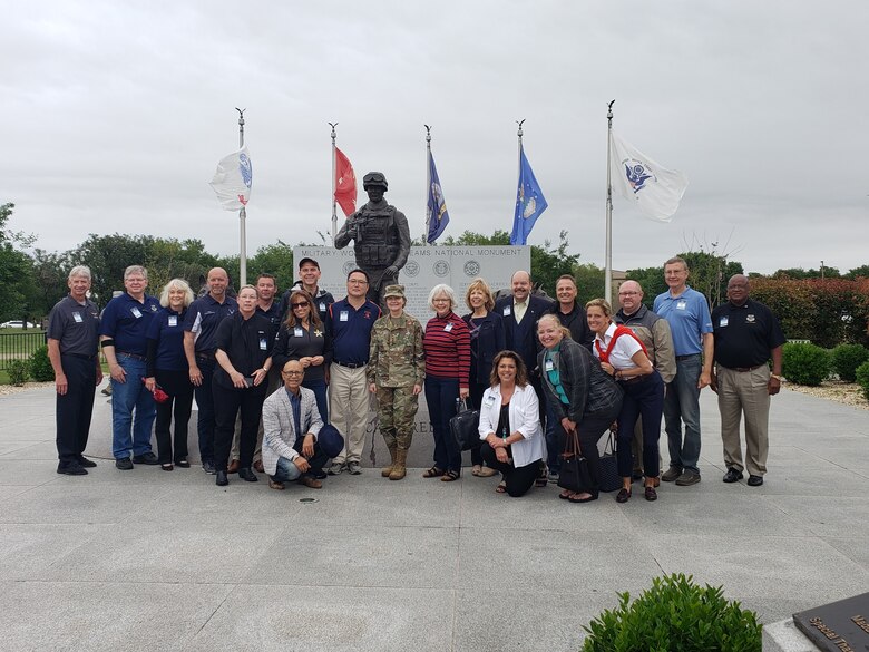 Gen. Maryanne Miller, Air Mobility Command commander, stands with AMC's civic leaders during a tour of the 37th Training Wing, also known as the “Gateway Wing," Joint Base San Antonio-Lackland, Texas.  The civic leaders got an inside look of trainees' daily life as they make their way from civilians to United States Air Force Airmen.  (U.S. Air Force photo by Traci Howells)