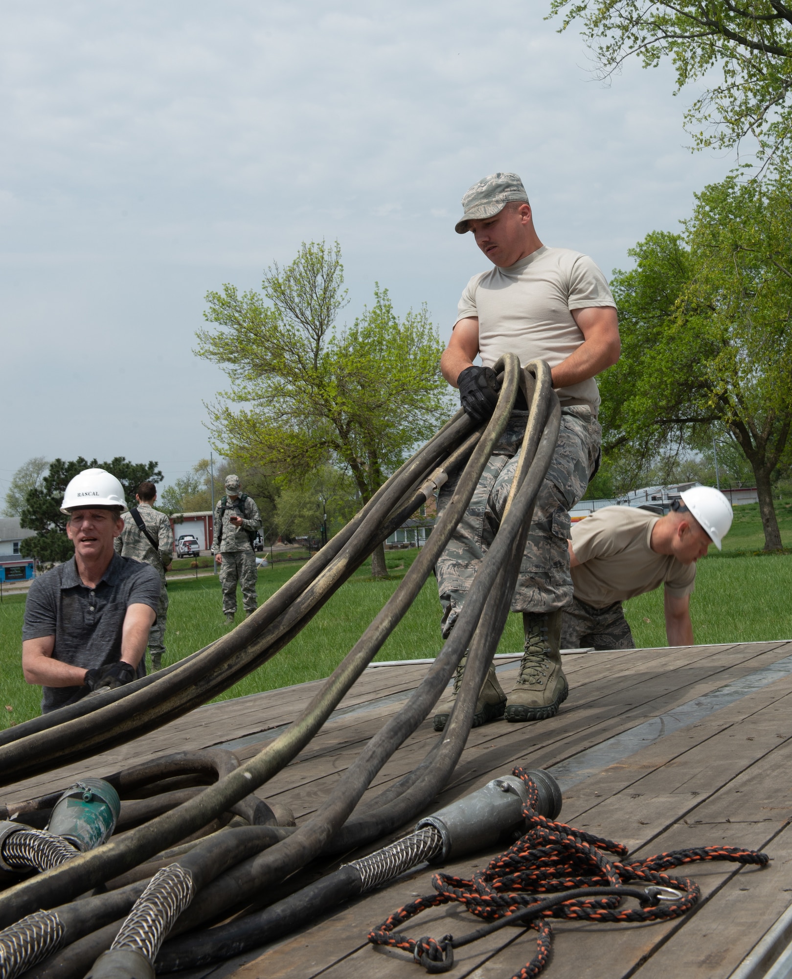 Airmen assigned to the 4th Component Maintenance Squadron at Seymour Johnson Air Force Base, North Carolina, unload power cables for the Rapid Assistance Support for Calibration unit May 6, 2019, at Offutt Air Force Base, Nebraska. PMEL is responsible for calibrating electronic, mechanical and physical dimensional test equipment in order to meet laboratory standards that are traceable to the National Institute of Standards. (U.S. Air Force photo by L. Cunningham)