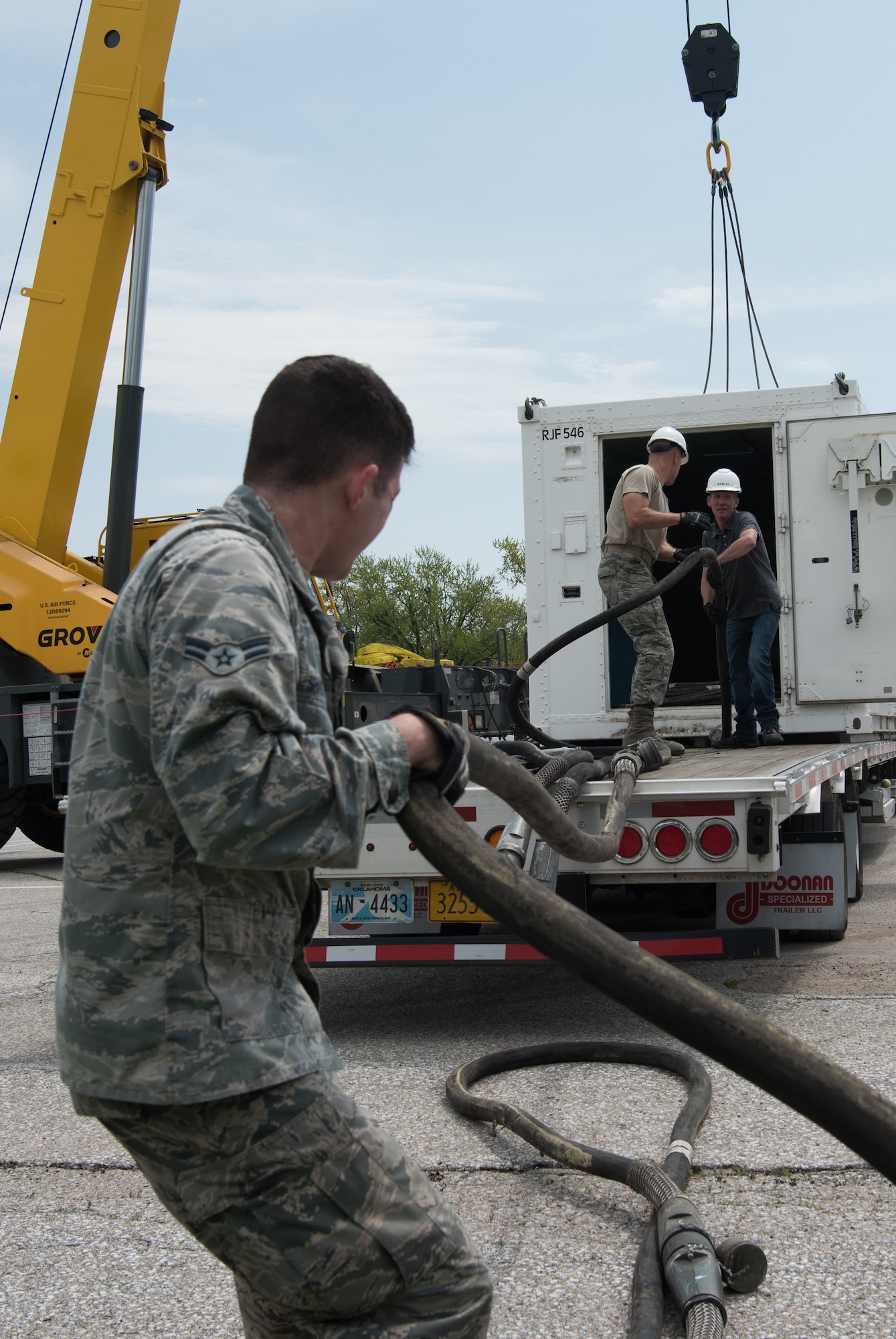 Airmen assigned to the 4th Component Maintenance Squadron at Seymour Johnson Air Force Base, North Carolina, unload power cables for the Rapid Assistance Support for Calibration unit May 6, 2019, at Offutt Air Force Base, Nebraska. PMEL is responsible for calibrating electronic, mechanical and physical dimensional test equipment in order to meet laboratory standards that are traceable to the National Institute of Standards. (U.S. Air Force photo by L. Cunningham)