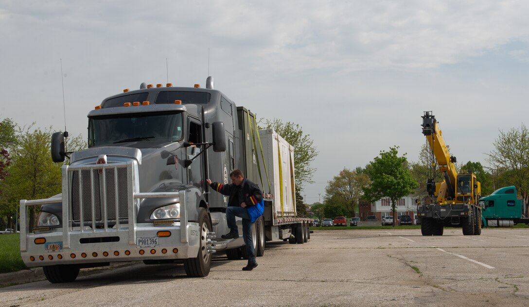George Peny, an electronics technician assigned to the 4th Component Maintenance Squadron at Seymour Johnson Air Force Base (AFB), North Carolina, meets a semi-truck as it delivers a piece of a Rapid Assistance Support for Calibration unit (RASCAL) May 6, 2019, at Offutt Air Force Base, Nebraska. The RASCAL was deployed from Seymour Johnson AFB to assist Offutt AFB’s Precision Measurement Equipment Laboratory staff who lost their facility in the March 2019 flood. (U.S. Air Force photo by L. Cunningham)