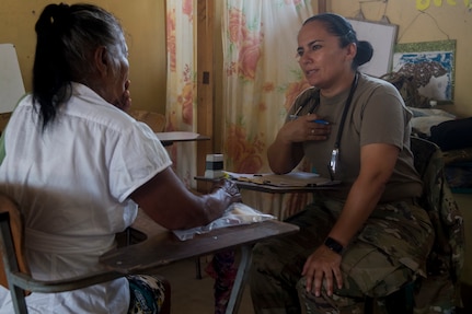 U.S. Army Capt. Sayda Fairfield, Joint Task Force – Bravo Medical Element physician assistant, address the concerns of a patient screening during a Medical Readiness Training Exercise (MEDRETE), May 9, 2019, in El Paraiso, Honduras. Members of JTF-B partnered with the Honduran Military and Ministry of Health to provide health care services for more than 1,300 Honduran citizens; reaching a third of the citizens in the towns of Argelia, Santa Maria and Las Dificultades in the El Paraiso Department. The goal of the mission was to provide the medical staff training in their areas of expertise as well as strengthen partnerships with the Honduran allies. (U.S. Air Force photo by Staff Sgt. Eric Summers Jr.)