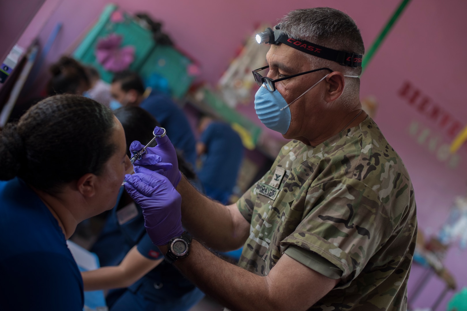 U.S. Army Col. Manuel Iravedra, Joint Task Force – Bravo Medical Element dentist, applies a numbing medication before a tooth extraction during a Medical Readiness Training Exercise (MEDRETE), May 9, 2019, in El Paraiso, Honduras. Members of JTF-B partnered with the Honduran Military and Ministry of Health to provide health care services for more than 1,300 Honduran citizens; reaching a third of the citizens in the towns of Argelia, Santa Maria and Las Dificultades in the El Paraiso Department. The goal of the mission was to provide the medical staff training in their areas of expertise as well as strengthen partnerships with the Honduran allies. (U.S. Air Force photo by Staff Sgt. Eric Summers Jr.)