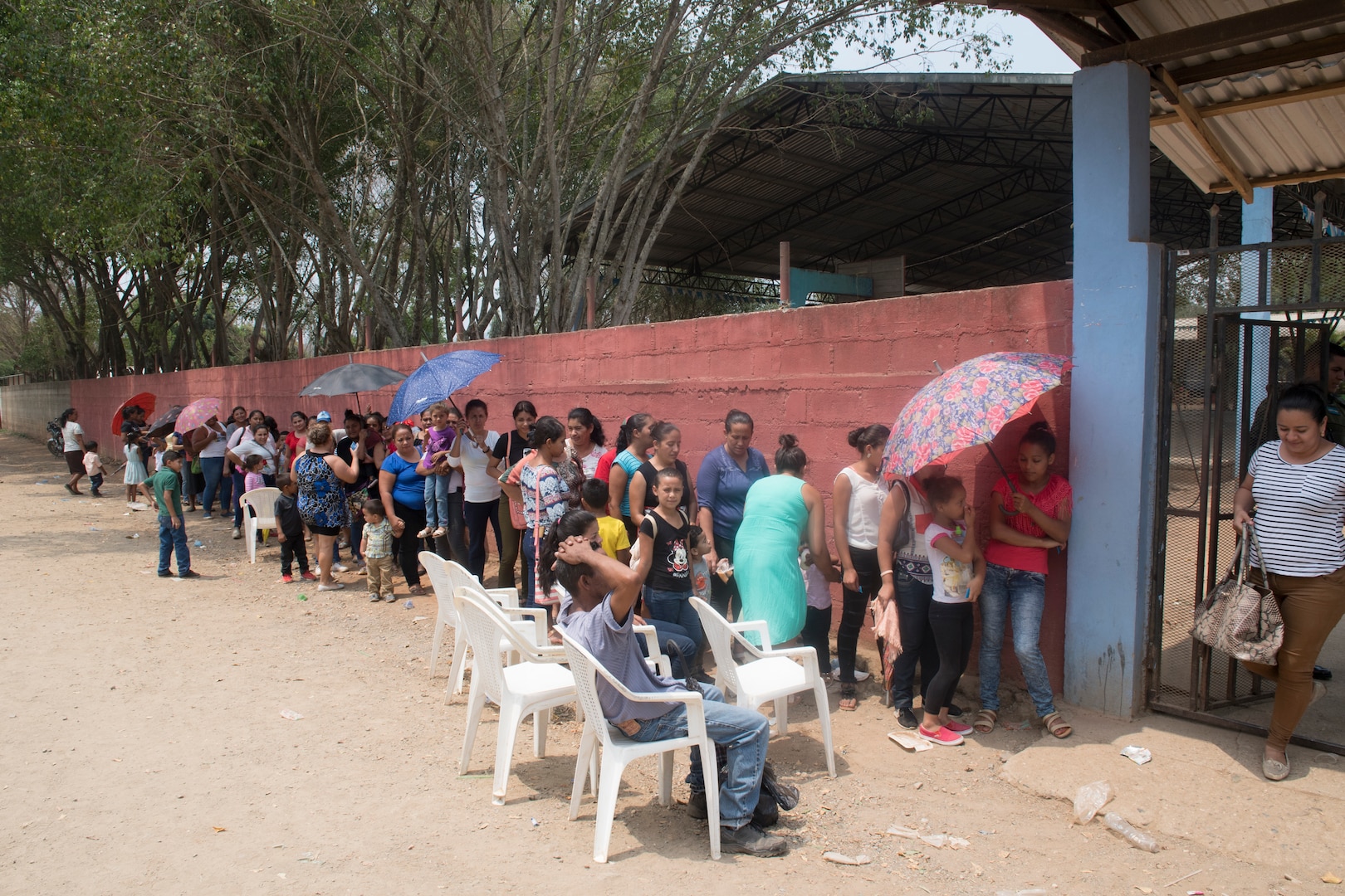 Honduran citizens stand in line to receive medical care during a Medical Readiness Training Exercise (MEDRETE), May 10, 2019, in El Paraiso, Honduras. Members of JTF-B partnered with the Honduran Military and Ministry of Health to provide health care services for more than 1,300 Honduran citizens; reaching a third of the citizens in the towns of Argelia, Santa Maria and Las Dificultades in the El Paraiso Department. The goal of the mission was to provide the medical staff training in their areas of expertise as well as strengthen partnerships with the Honduran allies. (U.S. Air Force photo by Staff Sgt. Eric Summers Jr.)