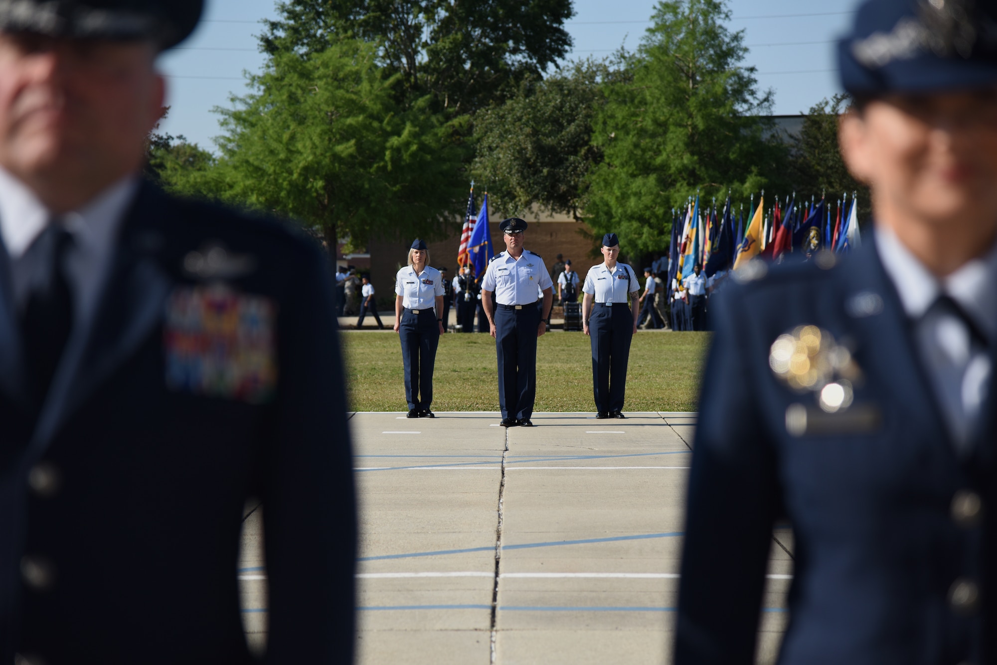 Keesler leadership stand at attention during the 81st Training Wing change of command ceremony on the Levitow Training Support Facility drill pad at Keesler Air Force Base, Mississippi, May 16, 2019. The ceremony is a symbol of command being exchanged from one commander to the next by the handing-off of a ceremonial guidon. U.S. Air Force Col. Debra Lovette, relinquished command of the 81st TRW to Col. Heather Blackwell. (U.S. Air Force photo by Kemberly Groue)