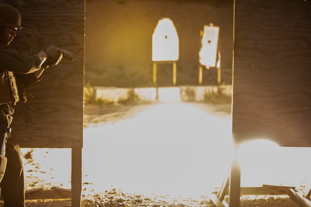 A Marine Corps Air Station Miramar Special Reactions Team (SRT) member prepares to clear an area after throwing a flash bang grenade during training at MCAS Miramar, Calif., May 15. The Marines conducted this training to hone their skills in close quarters combat and further familiarize themselves with the M1911 Service Pistol. (U.S. Marine Corps photo by Sgt. Jake McClung)