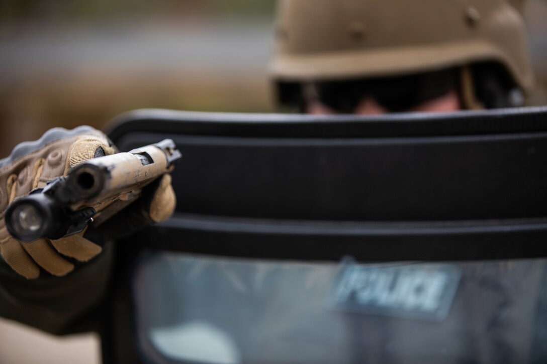 A Marine Corps Air Station Miramar Special Reactions Team (SRT) member poses for a photograph during training at MCAS Miramar, Calif., May 15. The Marines conducted this training to hone their skills in close quarters combat and further familiarize themselves with the M1911 Service Pistol. (U.S. Marine Corps photo by Sgt. Jake McClung)