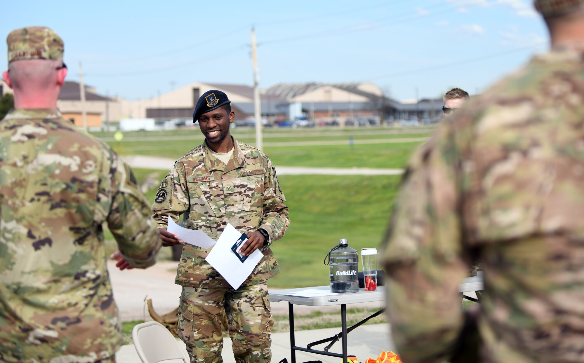 Senior Airman Charles Williams, a 28th Security Forces Squadron response force team member, announces the winners of the Police Week Ruck Challenge at Heritage Lake on Ellsworth Air Force Base, S.D., May 13, 2019.  Participants were required to complete the 4.5 mile ruck, while carrying at least 40 pounds on their backs. The challenge was held in recognition of National Police Week, which pays tribute to law enforcement officers who have died while serving communities nationwide. (U.S. Air Force photo by Airman 1st Class Christina Bennett)