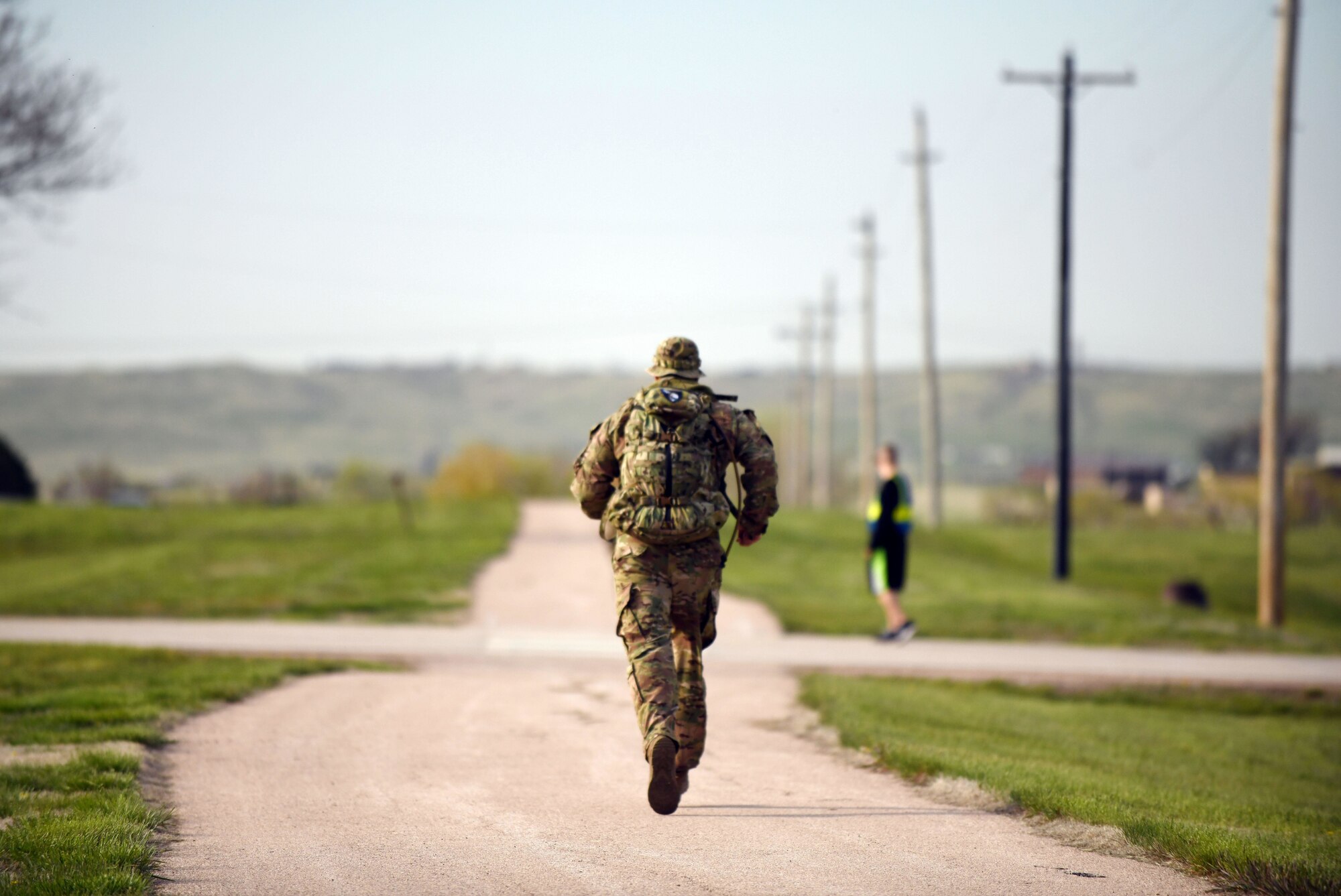 An Airman participates in the 4.5-mile Police Week Ruck Challenge at Heritage Lake on Ellsworth Air Force Base, S.D., May 13, 2019. The event was organized by the 28th Security Forces Squadron in honor of National Police Week. The week is dedicated to the countless numbers of law enforcement officers who have died while serving and protecting communities nationwide. (U.S. Air Force photo by Airman 1st Class Christina Bennett)